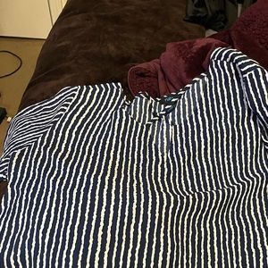I have a size 2x it is by RUE21 it has dark blue and white pinstriped shirt.